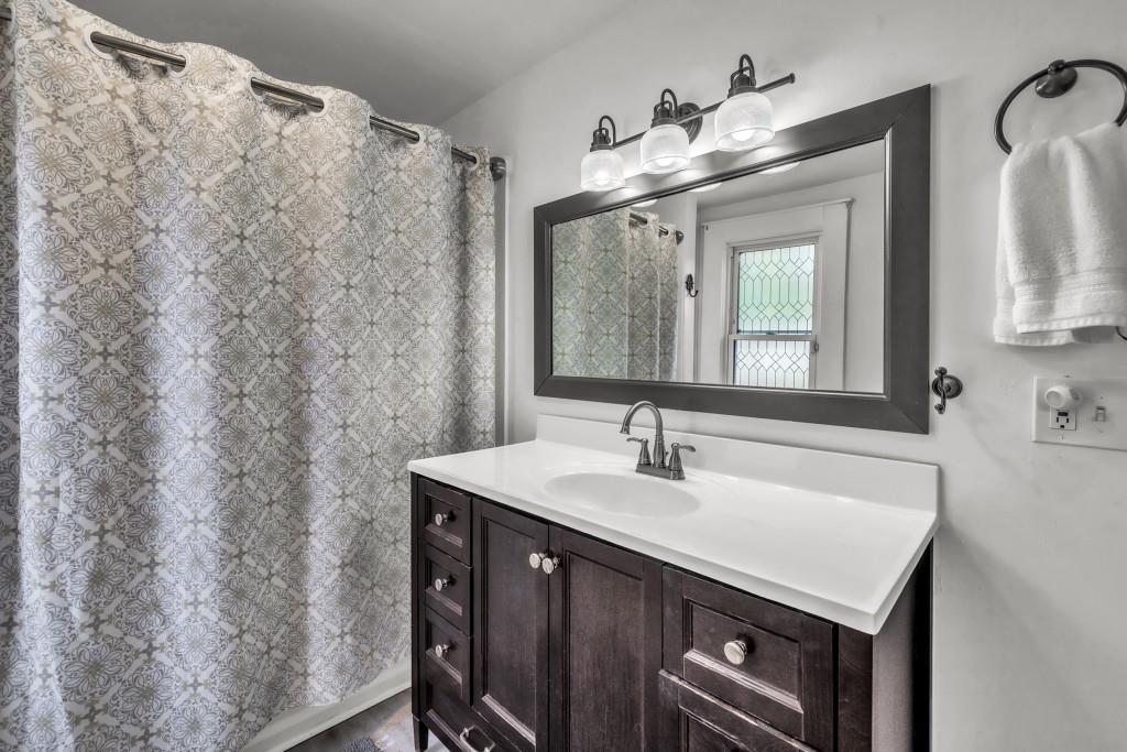 911 Highway 85 Connector Brooks, GA 30205 - Photo 27 of 45 a bathroom with a sink vanity and a mirror