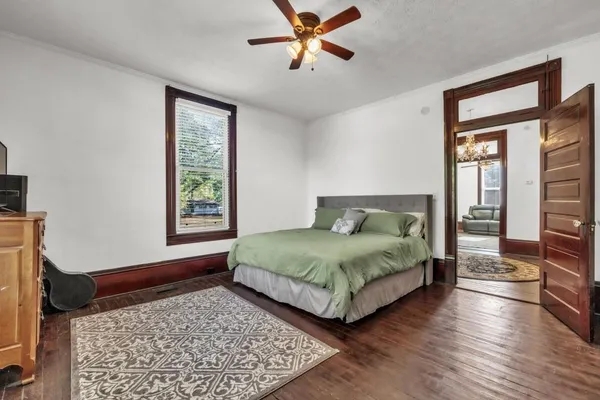a bedroom with a bed and a fireplace