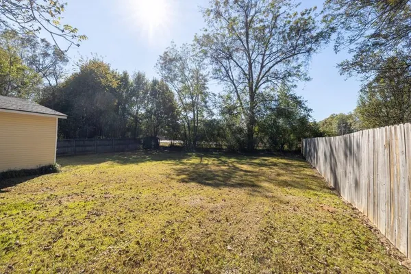 a view of outdoor space with deck and yard