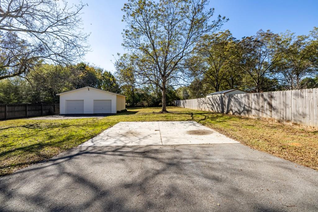 911 Highway 85 Connector Brooks, GA 30205 - Photo 39 of 45 a view of yard with swimming pool and trees