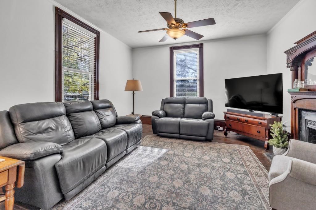 911 Highway 85 Connector Brooks, GA 30205 - Photo 4 of 45 a living room with furniture and a flat screen tv