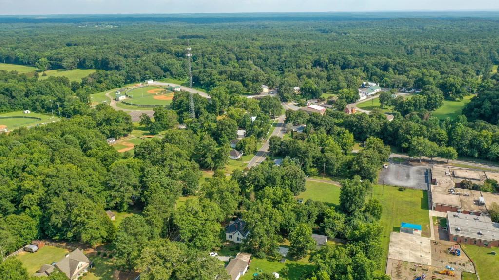 911 Highway 85 Connector Brooks, GA 30205 - Photo 45 of 45 a view of a garden with a building in the background