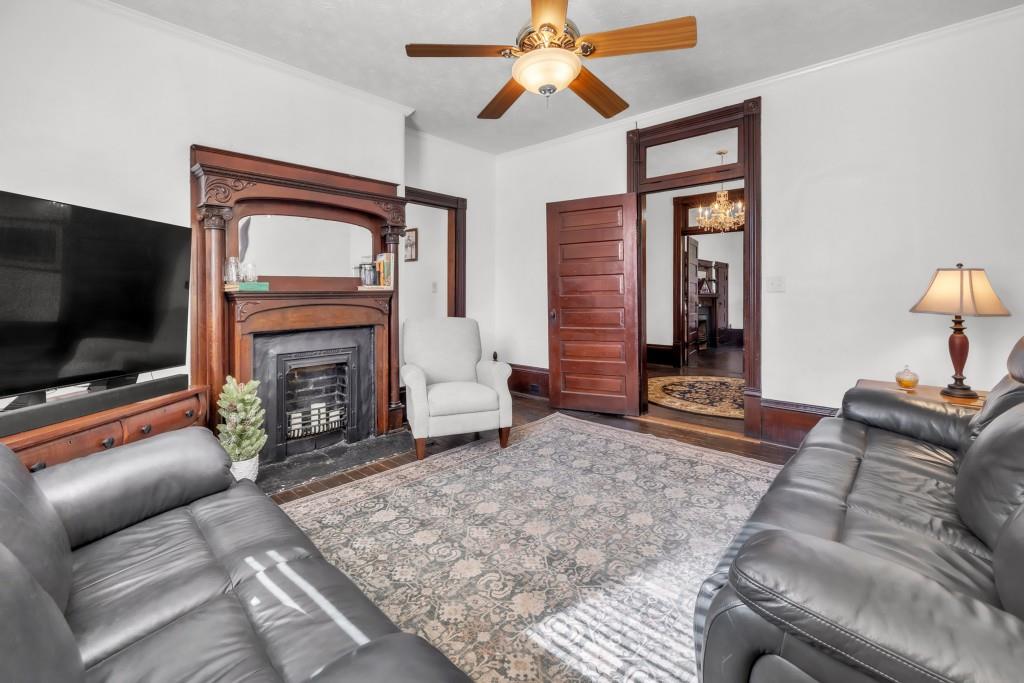 911 Highway 85 Connector Brooks, GA 30205 - Photo 6 of 45 a living room with furniture a flat screen tv and a fireplace