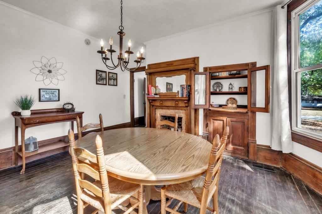911 Highway 85 Connector Brooks, GA 30205 - Photo 9 of 45 a dining room with furniture a chandelier and wooden floor