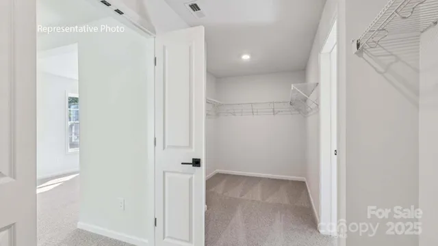 a view of a hallway with closet