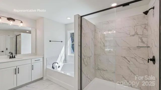 a bathroom with a tub sink and mirror