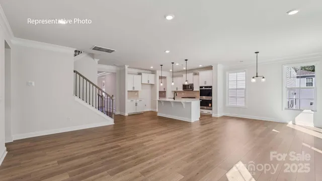a view of kitchen and kitchen with wooden floor