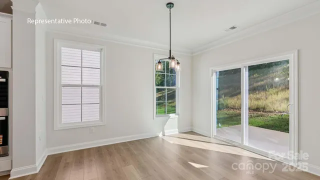 a view of an empty room with windows