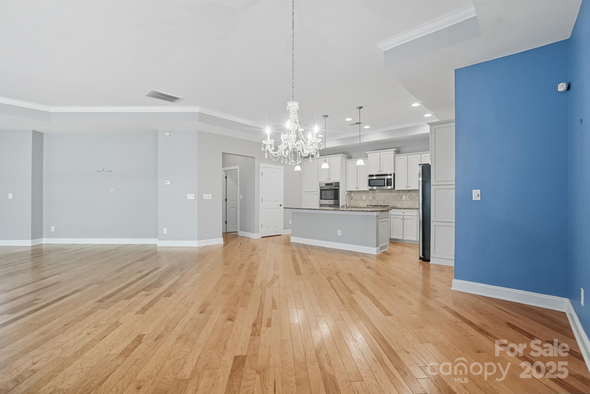 2232 Coltsview Lane Matthews, NC 28105 - Photo 11 of 42 a view of a kitchen with wooden floor and a kitchen