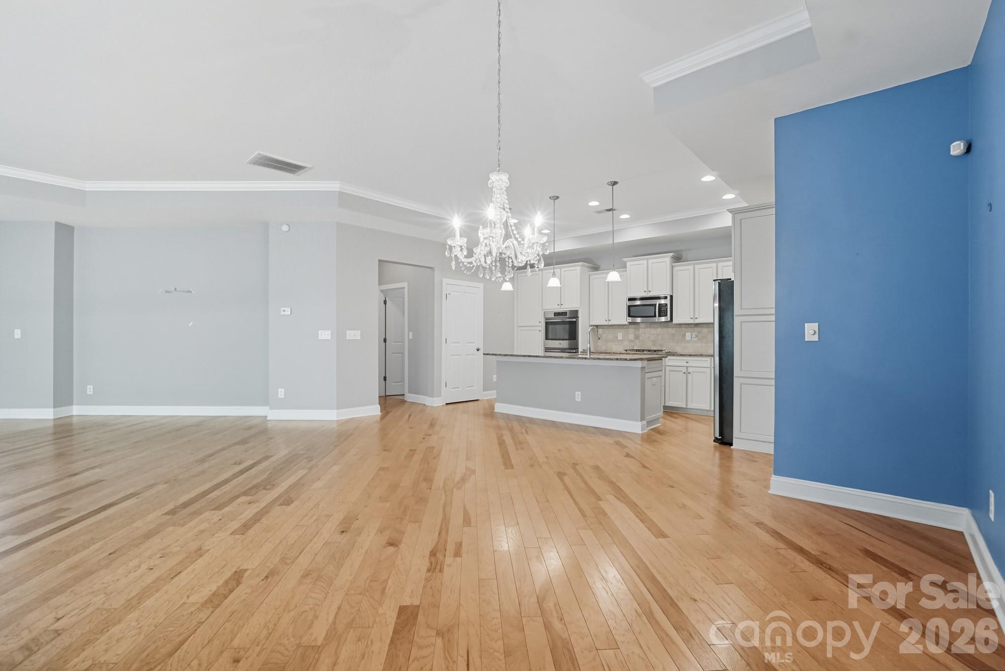 2232 Coltsview Lane Matthews, NC 28105 - Photo 13 of 47 a view of a kitchen with wooden floor and a kitchen
