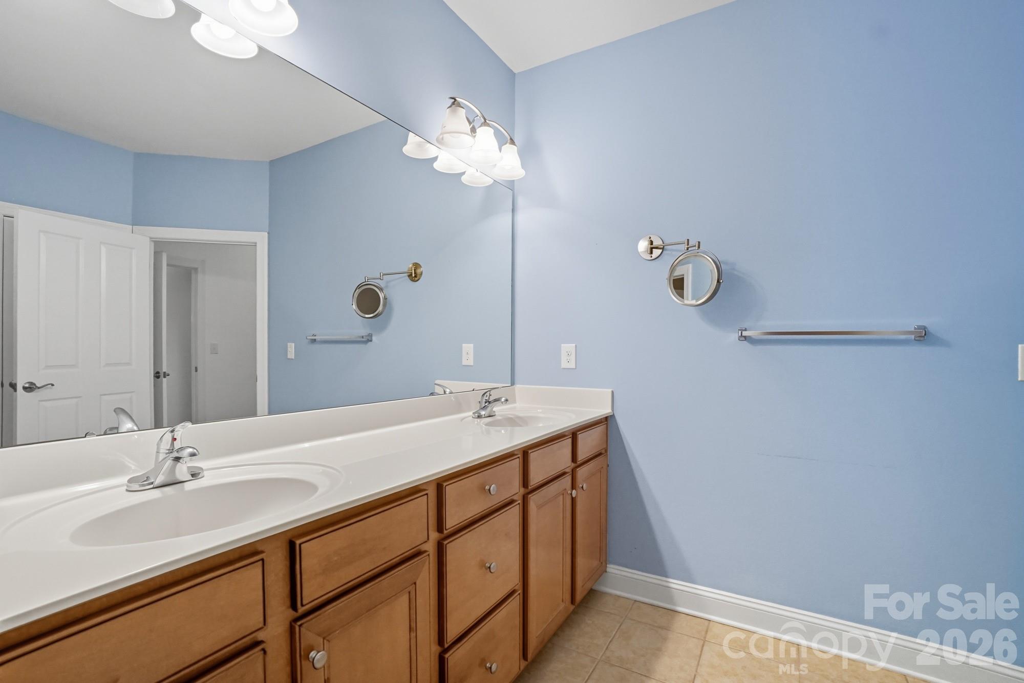 2232 Coltsview Lane Matthews, NC 28105 - Photo 30 of 47 a bathroom with a double vanity sink and a mirror
