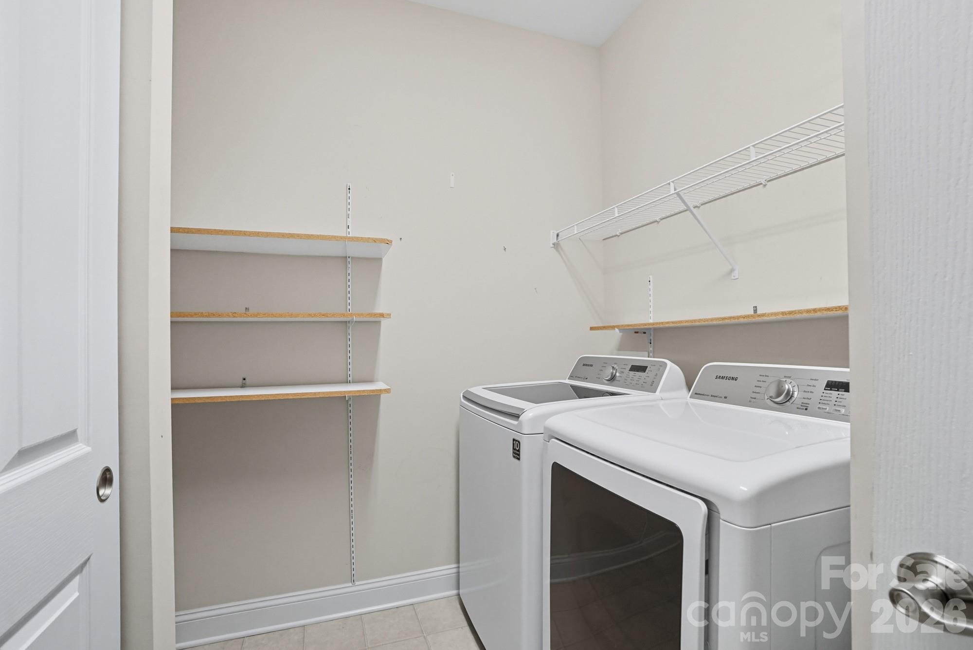 2232 Coltsview Lane Matthews, NC 28105 - Photo 35 of 47 a utility room with dryer and washer