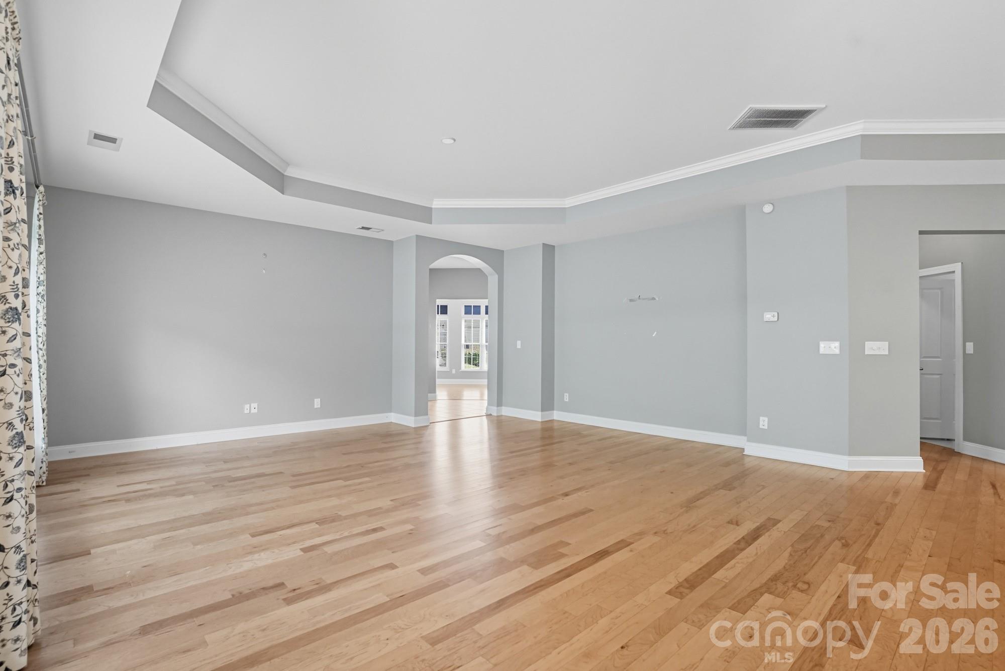 2232 Coltsview Lane Matthews, NC 28105 - Photo 7 of 47 a view of an empty room with wooden floor