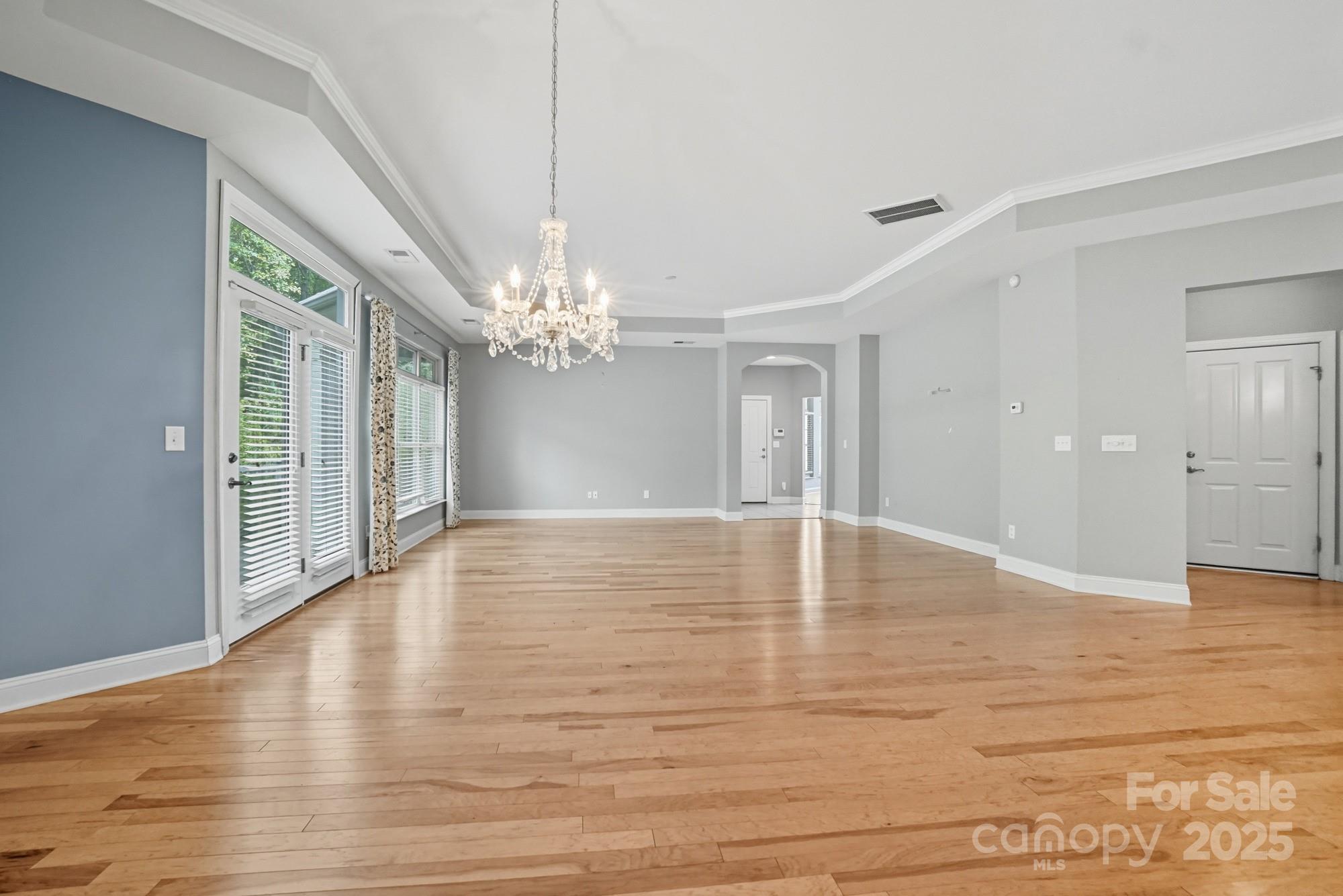 2232 Coltsview Lane Matthews, NC 28105 - Photo 10 of 42 a view of empty room with wooden floor and fan