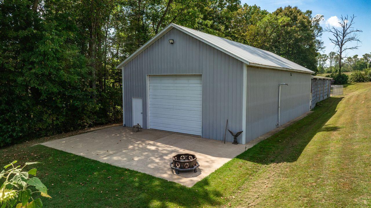 1481 Thornton Road Russell Springs, KY 42642 - Photo 10 of 60 30 X 60 large insulated equipment building with electric, concrete floor, pellet stove for heat