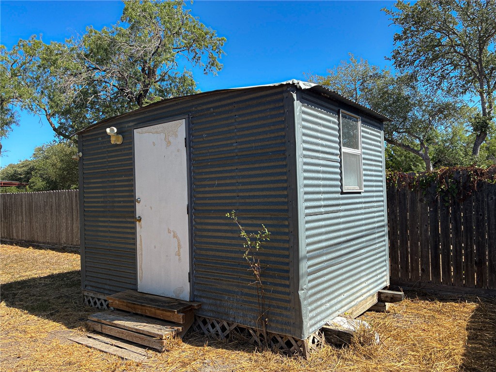 Undisclosed Address Three Rivers, TX 78071 - Photo 9 of 12 a front view of a house with garage