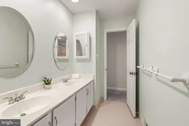 an empty room with window fire place and furniture