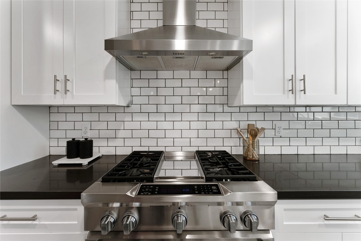 6623 Housman Houston, TX 77055 - Photo 11 of 38 a stove top oven sitting inside of a kitchen
