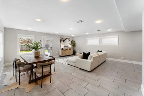 a bedroom with a bed and a wooden floor