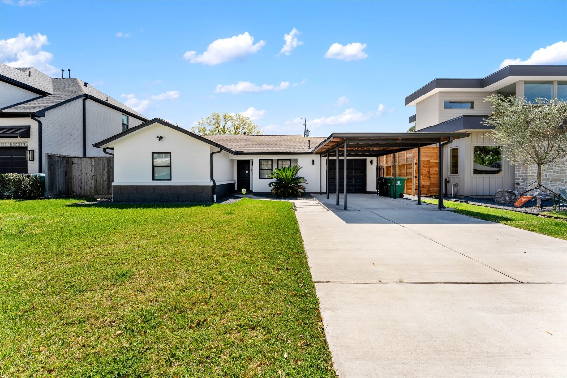 6623 Housman Houston, TX 77055 - Photo 2 of 38 a front view of house with yard and green space