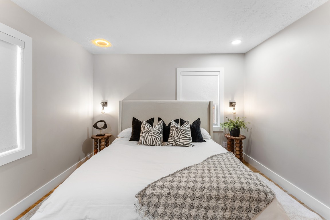 6623 Housman Houston, TX 77055 - Photo 22 of 38 a bed room with a bed and a lamp