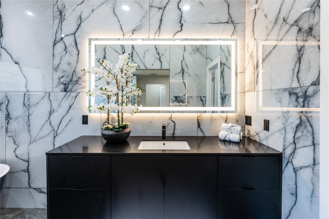 6623 Housman Houston, TX 77055 - Photo 24 of 38 a bathroom with a sink and a mirror