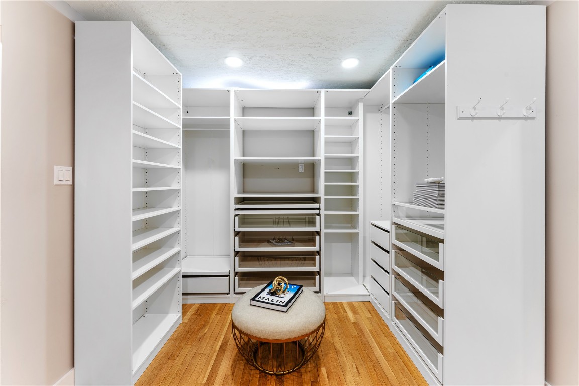 6623 Housman Houston, TX 77055 - Photo 28 of 38 a view of walk in closet with empty racks