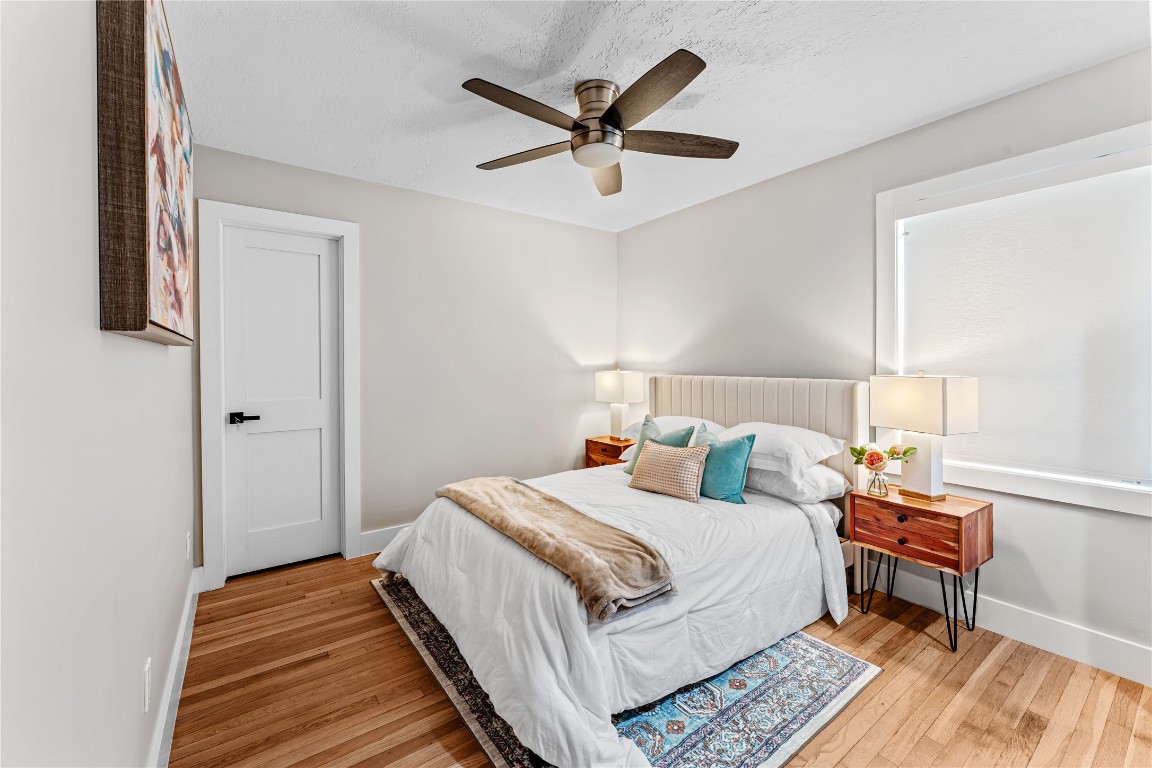 6623 Housman Houston, TX 77055 - Photo 29 of 38 a bedroom with a bed and a ceiling fan