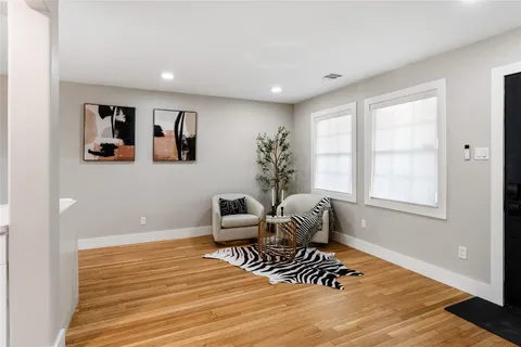 a view of a sink a counter top space and cabinets