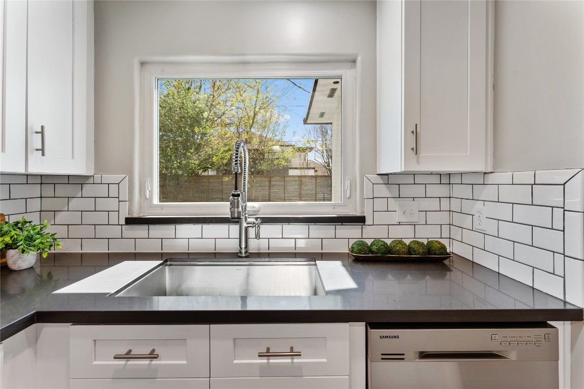 6623 Housman Houston, TX 77055 - Photo 10 of 38 a view of a sink a counter top space and cabinets