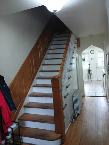 a view of entryway with wooden floor