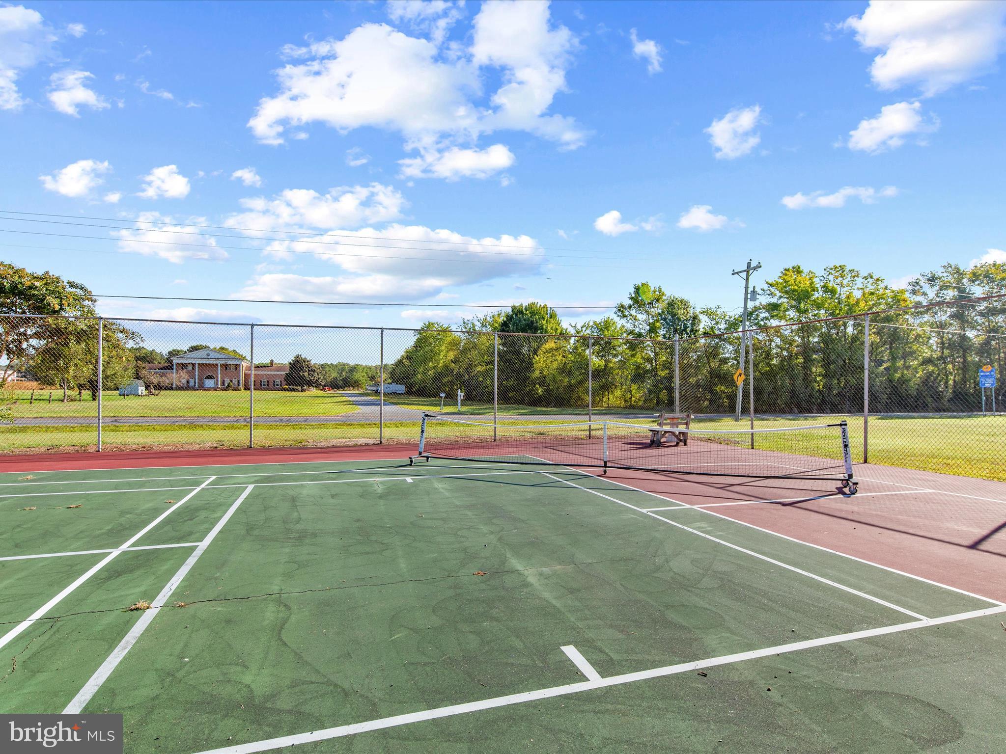 13374 Cove Landing Road Bishopville, MD 21813 - Photo 103 of 108 a view of tennis court with lots of trees in the background