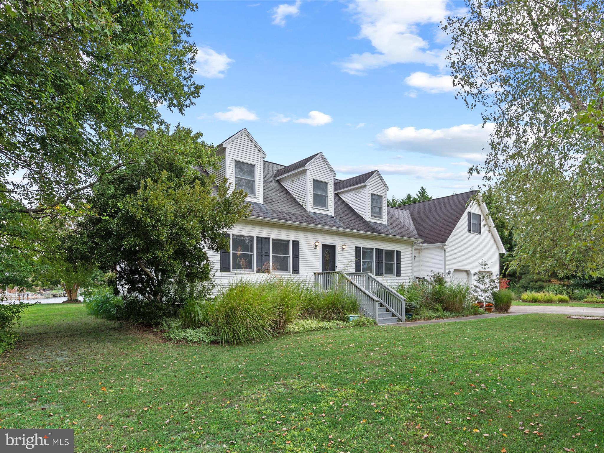 13374 Cove Landing Road Bishopville, MD 21813 - Photo 2 of 108 a view of a house with a big yard plants and large trees