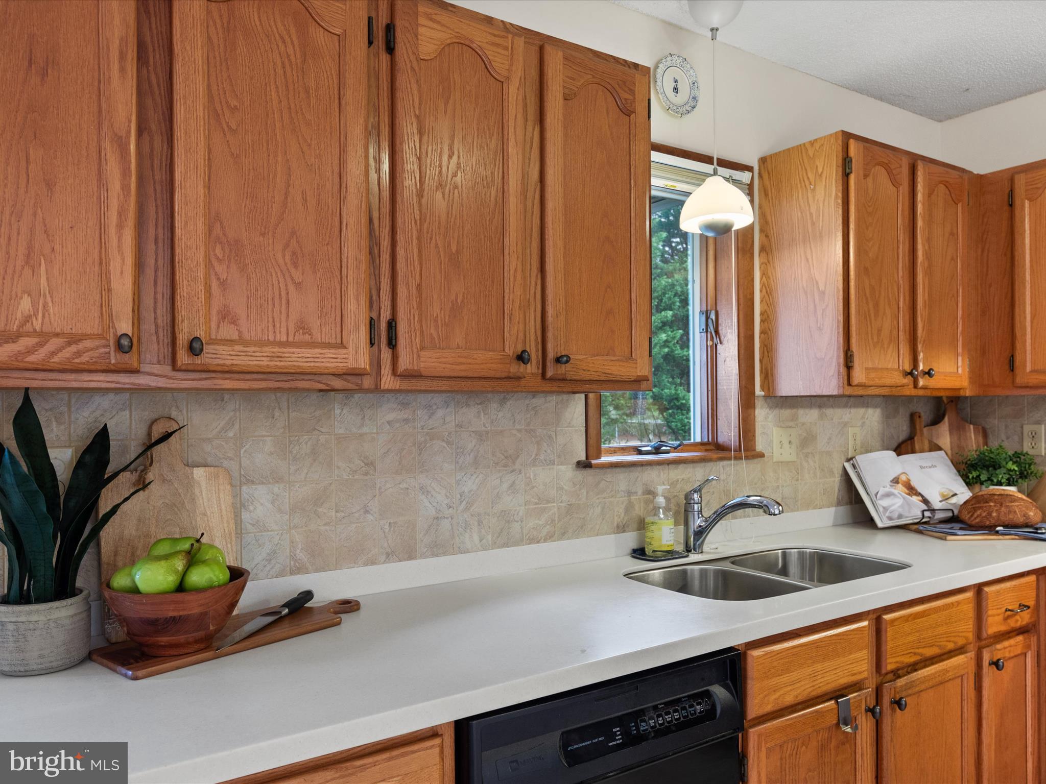 13374 Cove Landing Road Bishopville, MD 21813 - Photo 22 of 108 a kitchen with stainless steel appliances granite countertop a sink a stove and cabinets
