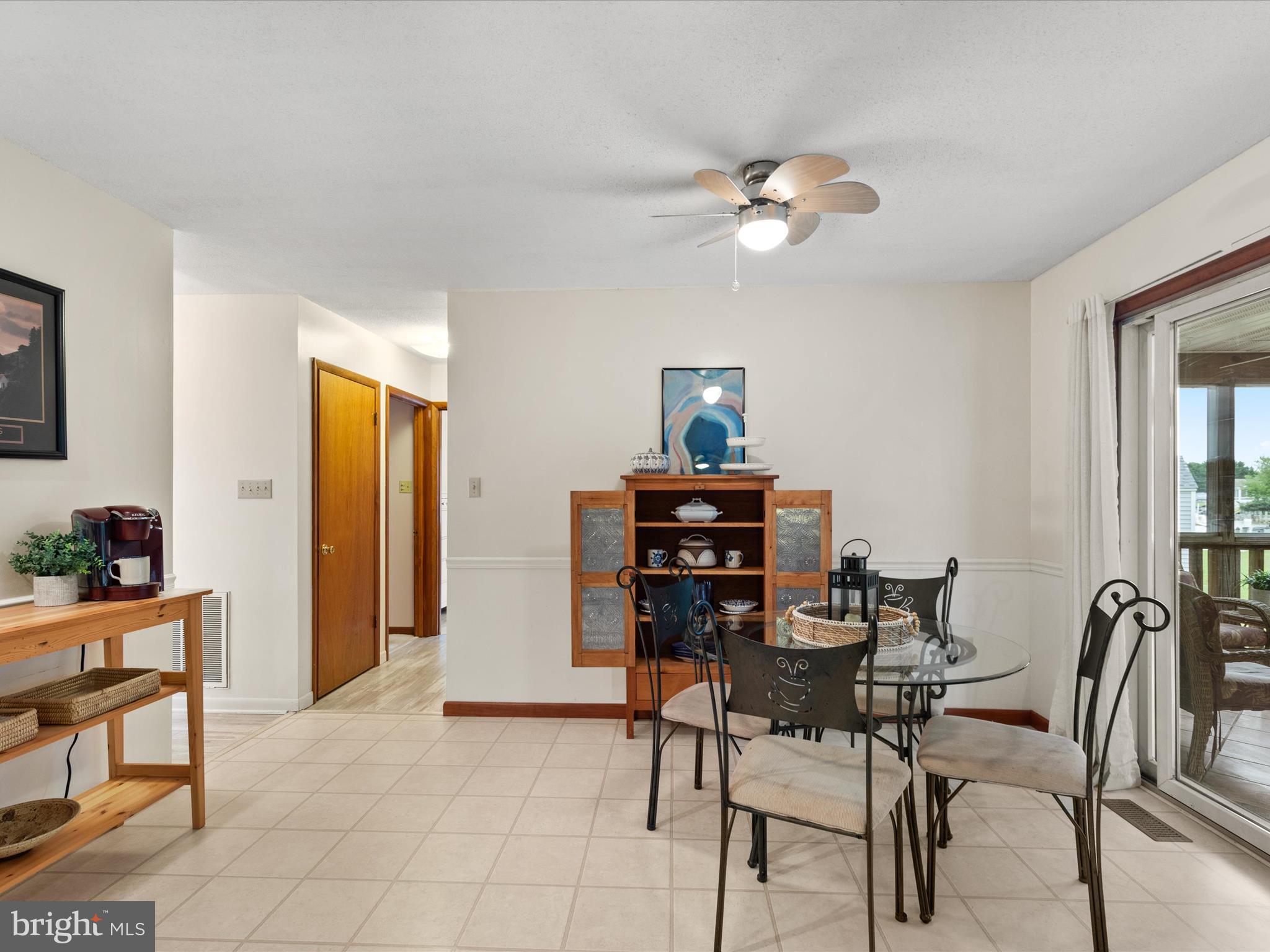 13374 Cove Landing Road Bishopville, MD 21813 - Photo 25 of 108 a view of a dining room with furniture and chandelier