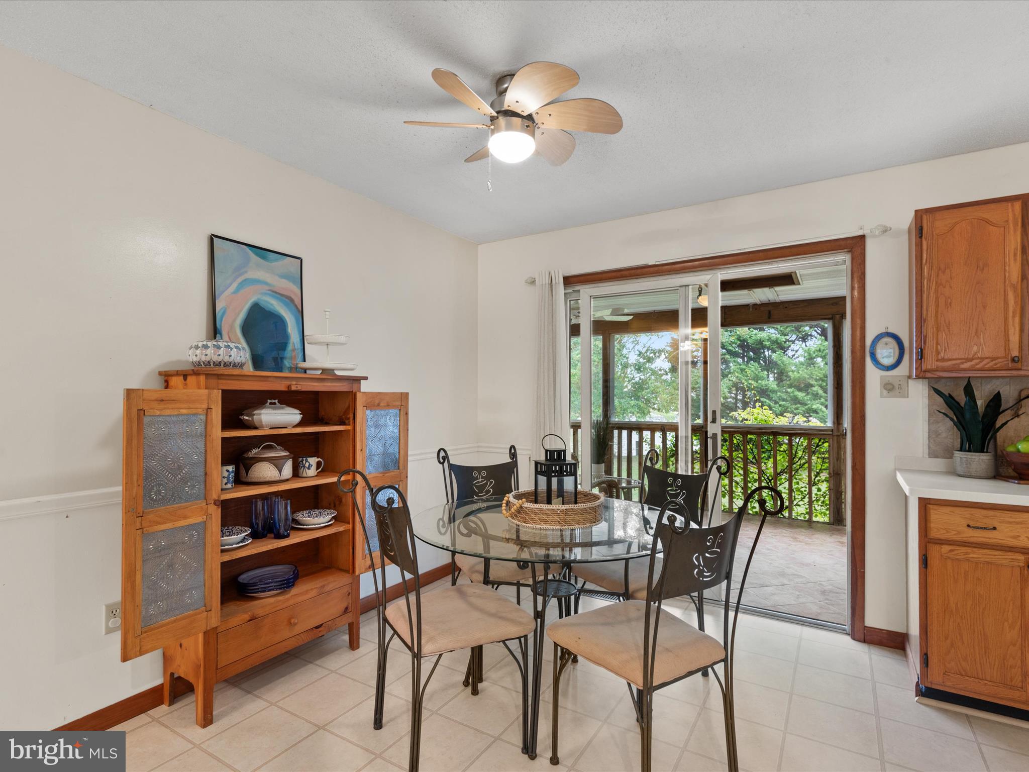 13374 Cove Landing Road Bishopville, MD 21813 - Photo 26 of 108 a view of a dining room with furniture window and outside view