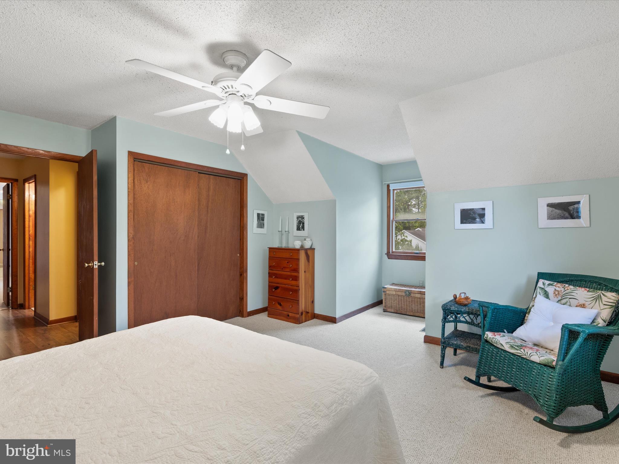 13374 Cove Landing Road Bishopville, MD 21813 - Photo 42 of 108 a bedroom with a bed and a chandelier