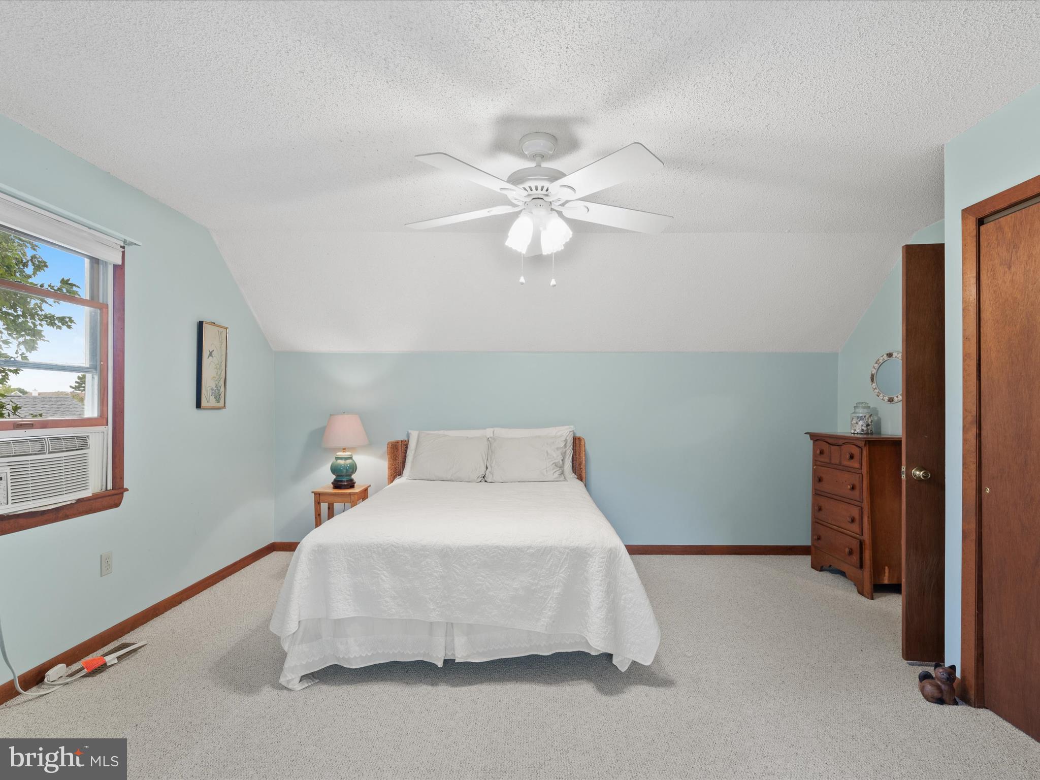 13374 Cove Landing Road Bishopville, MD 21813 - Photo 43 of 108 a bedroom with a bed and a chandelier