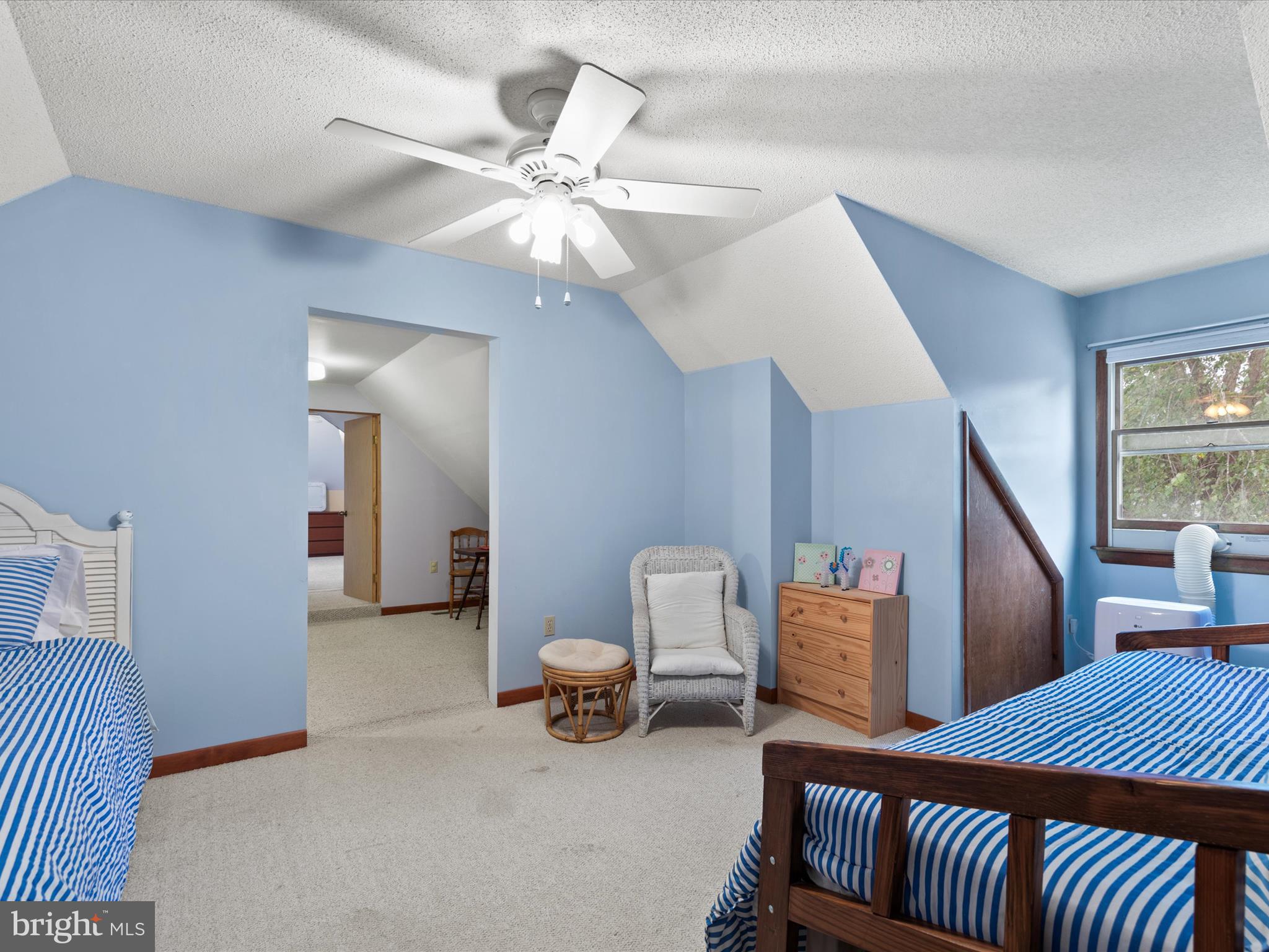 13374 Cove Landing Road Bishopville, MD 21813 - Photo 50 of 108 a bedroom with furniture and a chandelier
