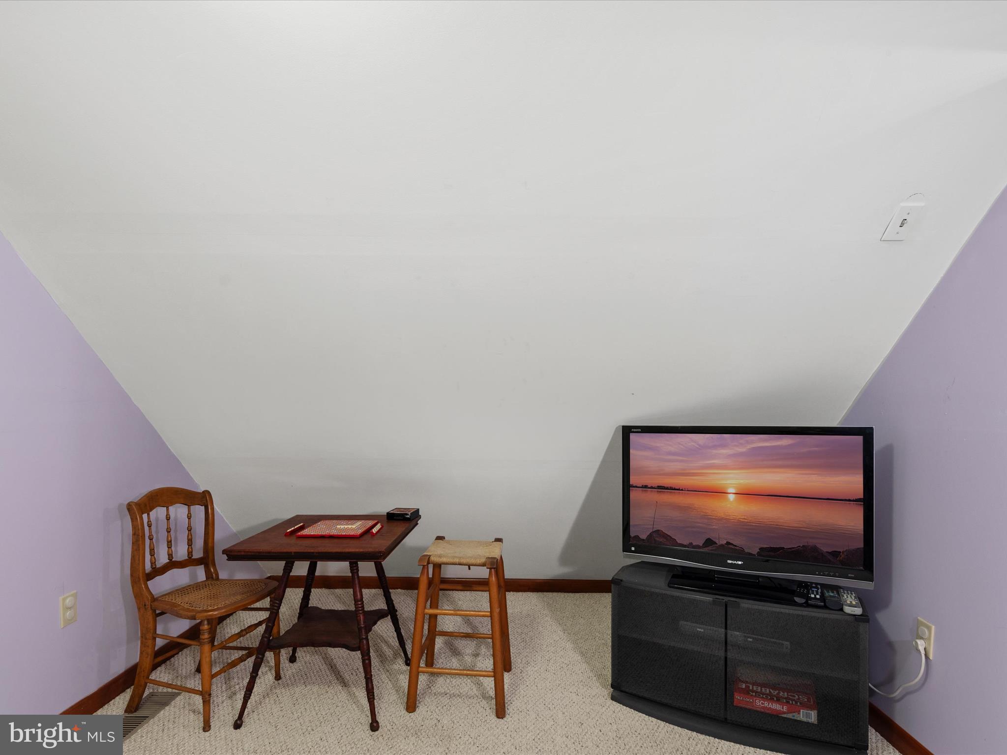 13374 Cove Landing Road Bishopville, MD 21813 - Photo 57 of 108 a living room with furniture and a flat screen tv
