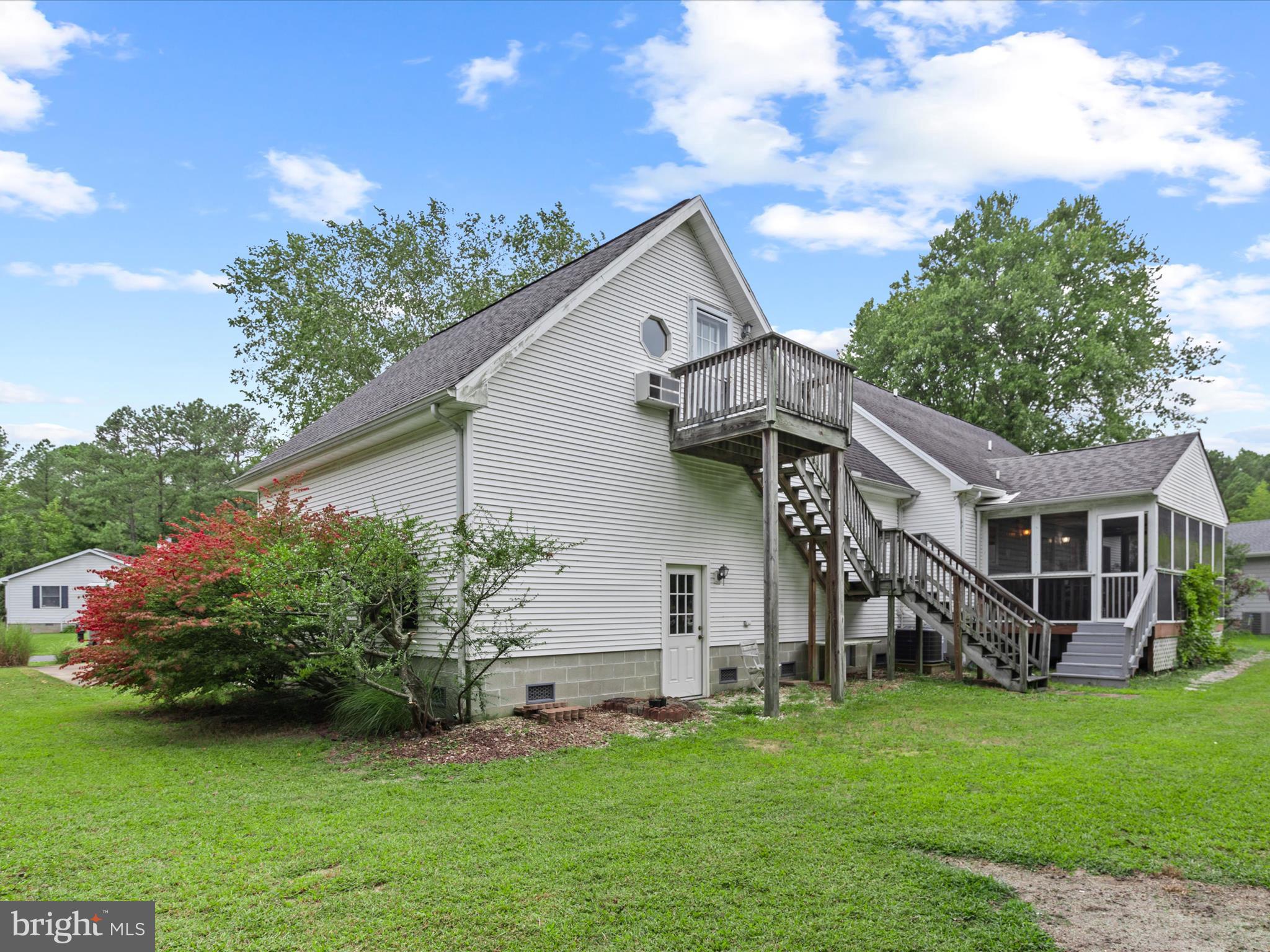 13374 Cove Landing Road Bishopville, MD 21813 - Photo 77 of 108 a front view of a house with a garden and plants