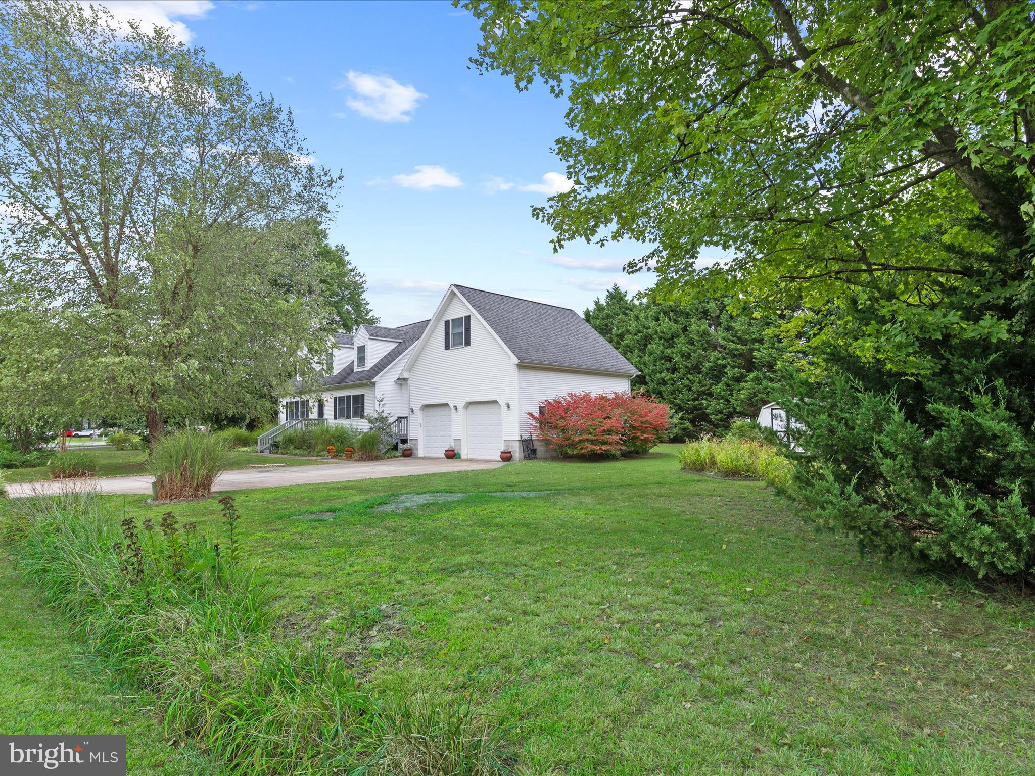 13374 Cove Landing Road Bishopville, MD 21813 - Photo 92 of 108 a front view of a house with yard and green space
