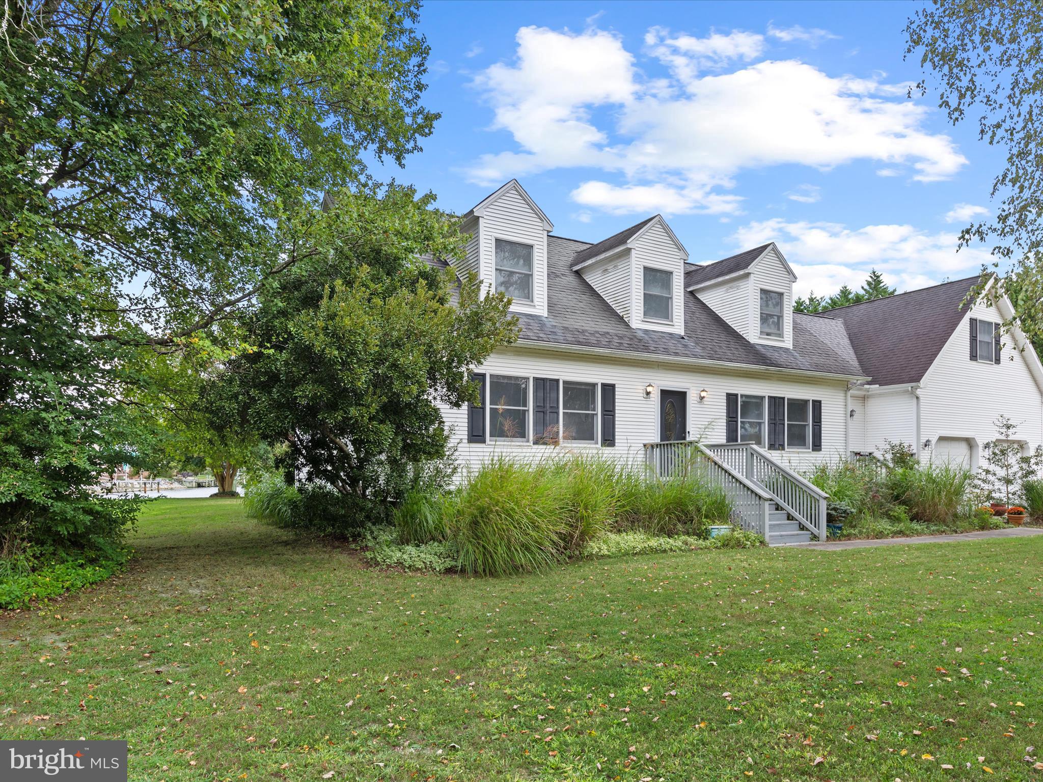 13374 Cove Landing Road Bishopville, MD 21813 - Photo 93 of 108 a front view of a house with a garden