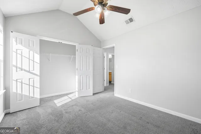 a view of an empty room with a window