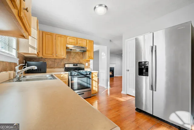 a large kitchen with a large window