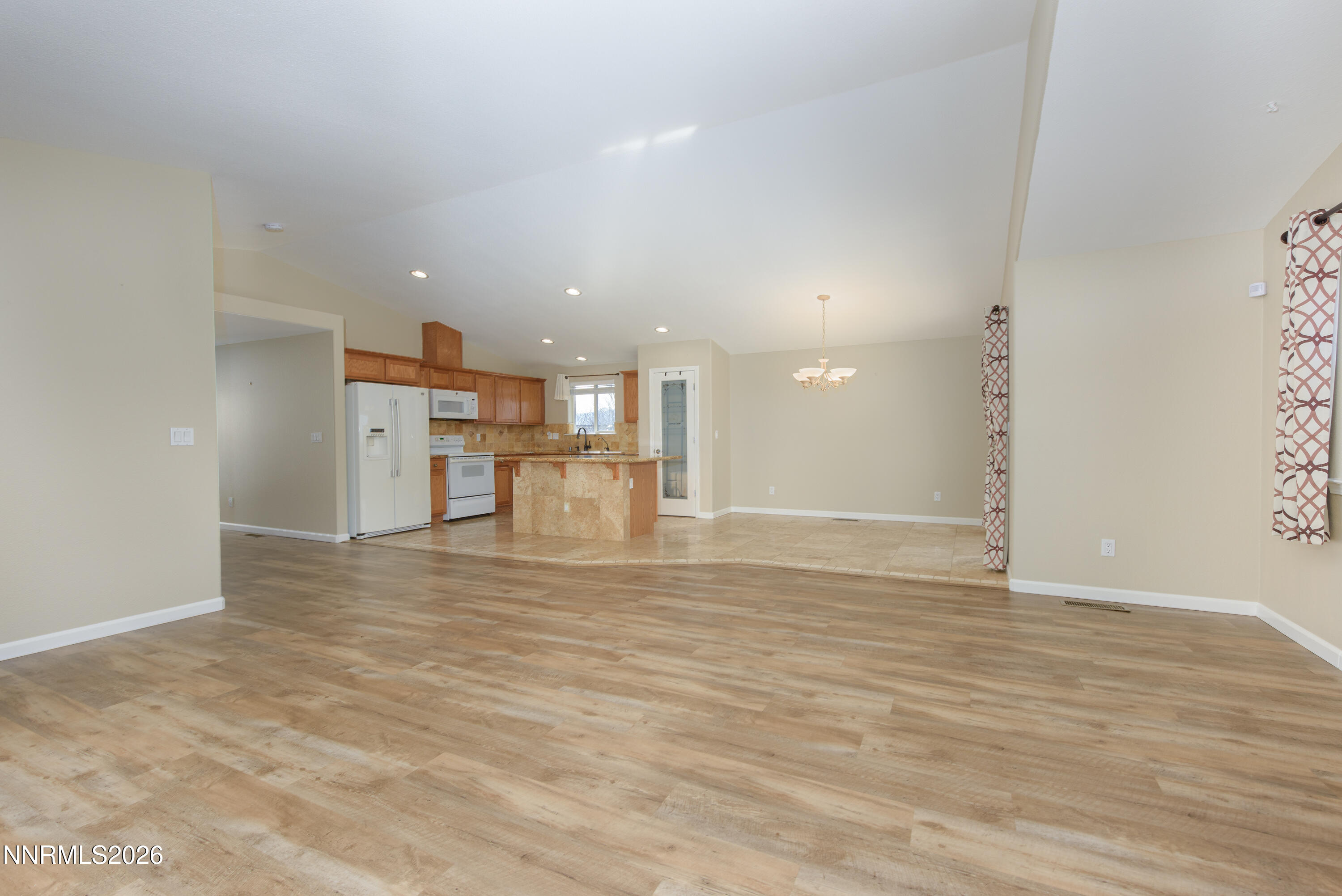 44 Conner Way Gardnerville, NV 89410 - Photo 11 of 38 a view of empty room with wooden floor
