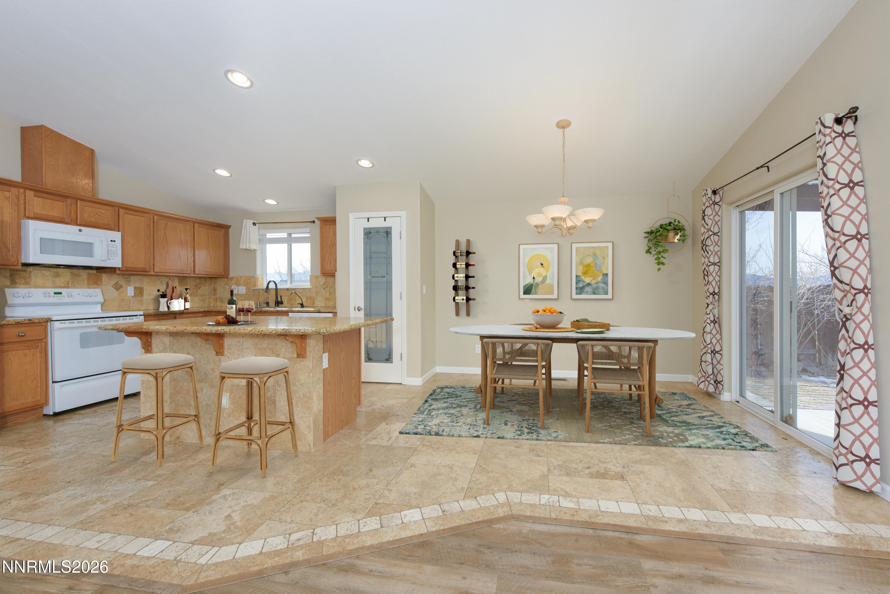 44 Conner Way Gardnerville, NV 89410 - Photo 12 of 38 a view of a dining room with furniture and chandelier