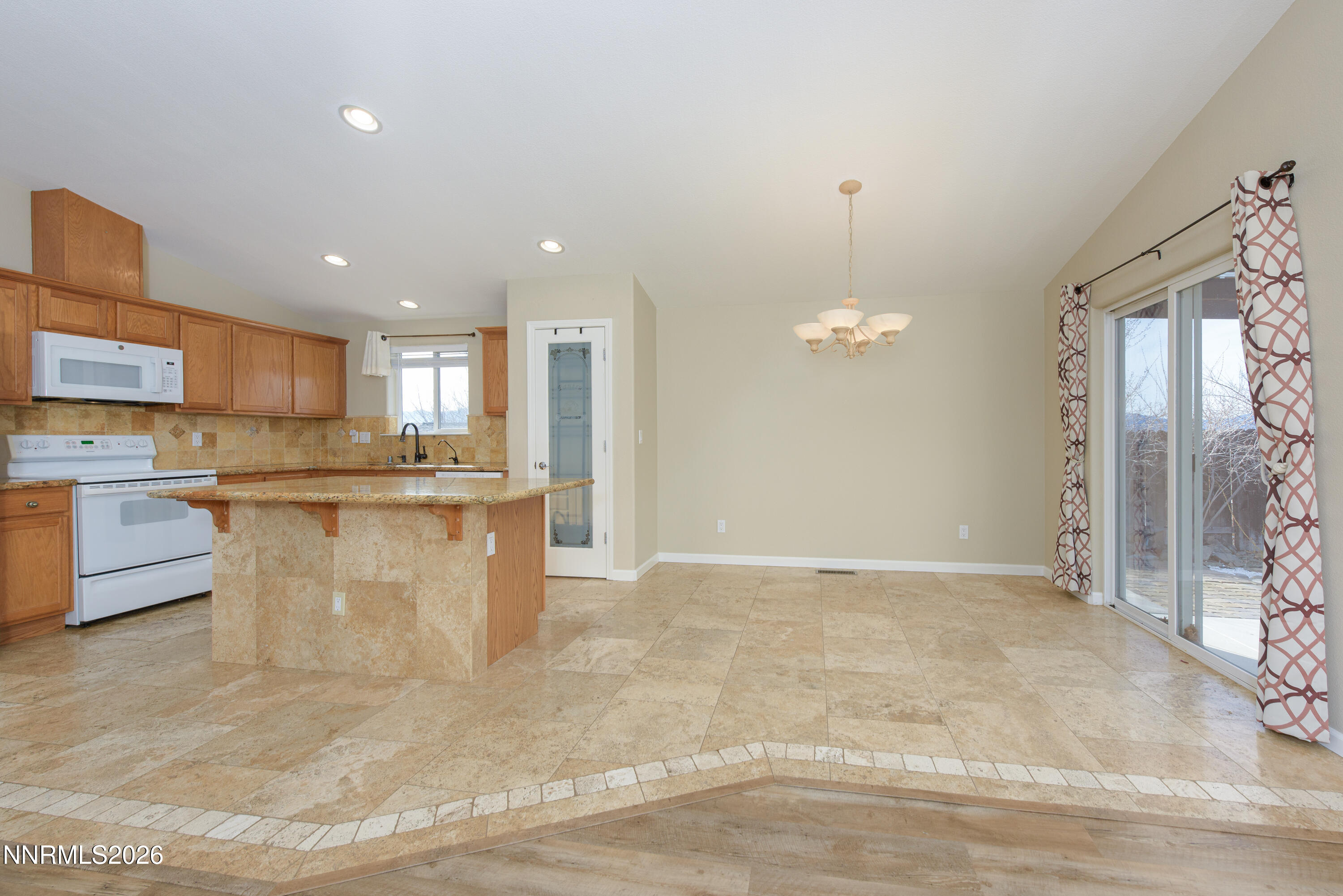 44 Conner Way Gardnerville, NV 89410 - Photo 13 of 38 a view of a kitchen with kitchen island a sink stainless steel appliances and cabinets