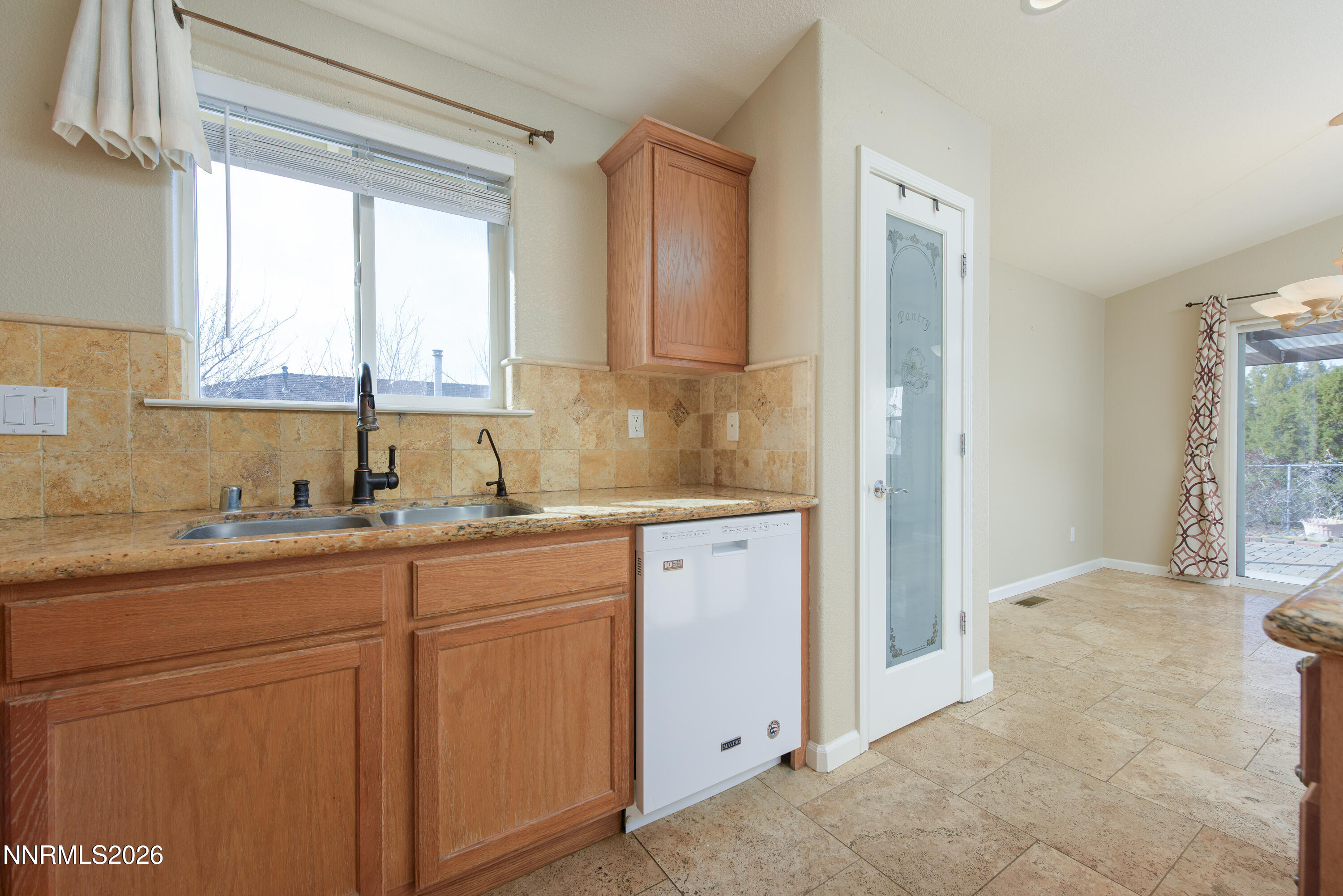 44 Conner Way Gardnerville, NV 89410 - Photo 16 of 38 a bathroom with a sink a mirror and a window