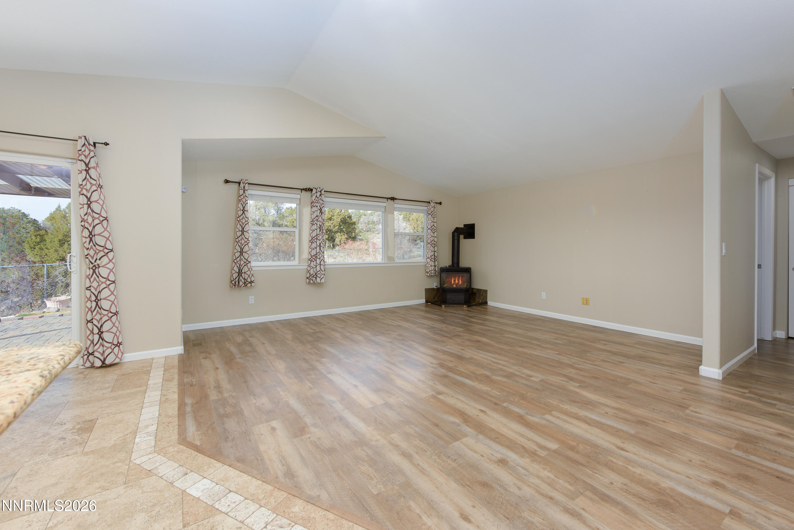 44 Conner Way Gardnerville, NV 89410 - Photo 7 of 38 a view of empty room with wooden floor and fan